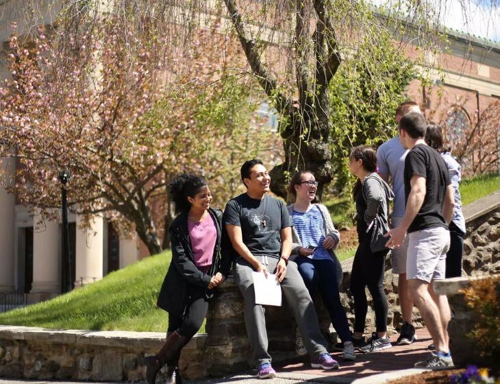 holy cross students talking and laughing