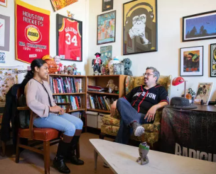 two people sitting and talking