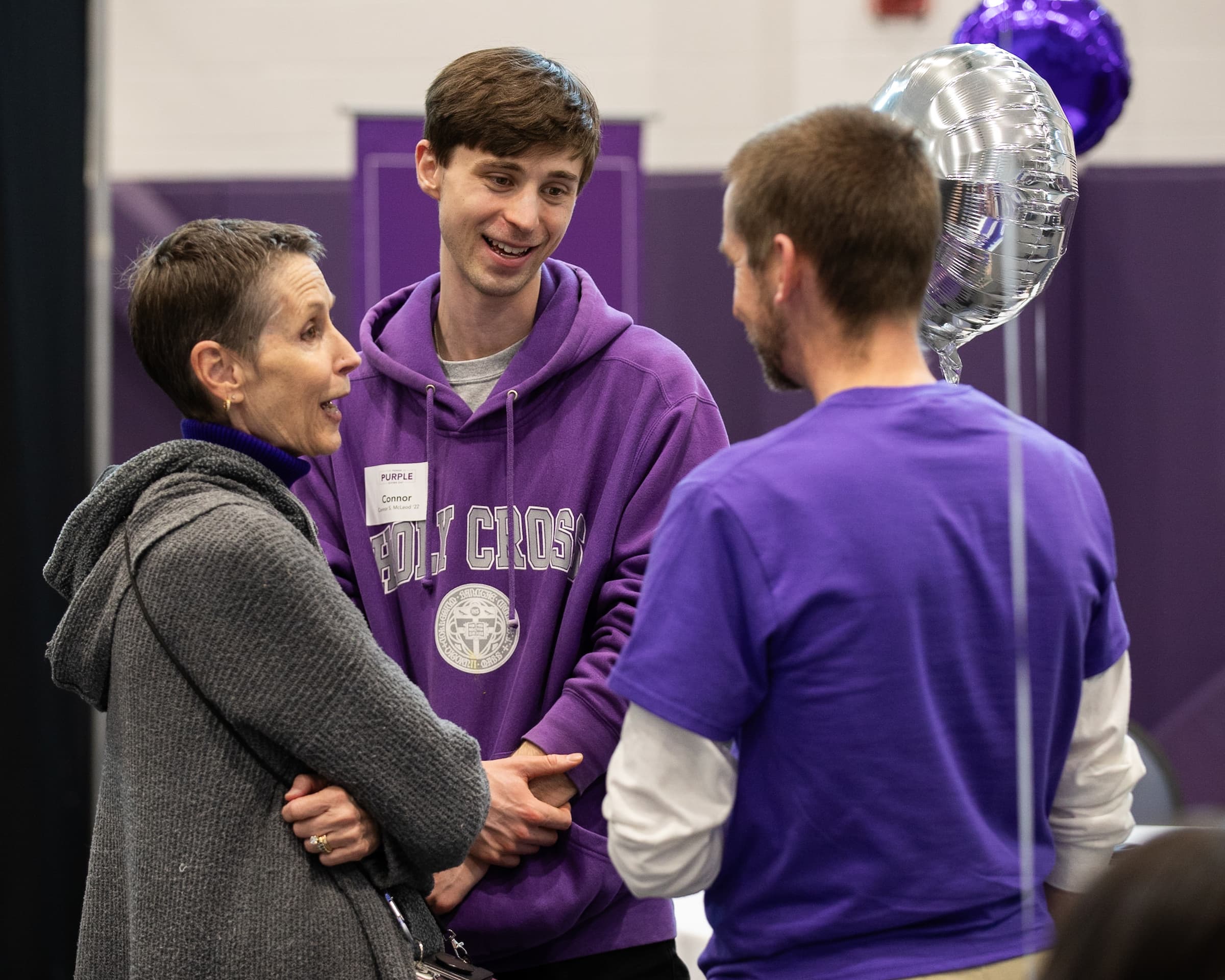 three people having a conversations